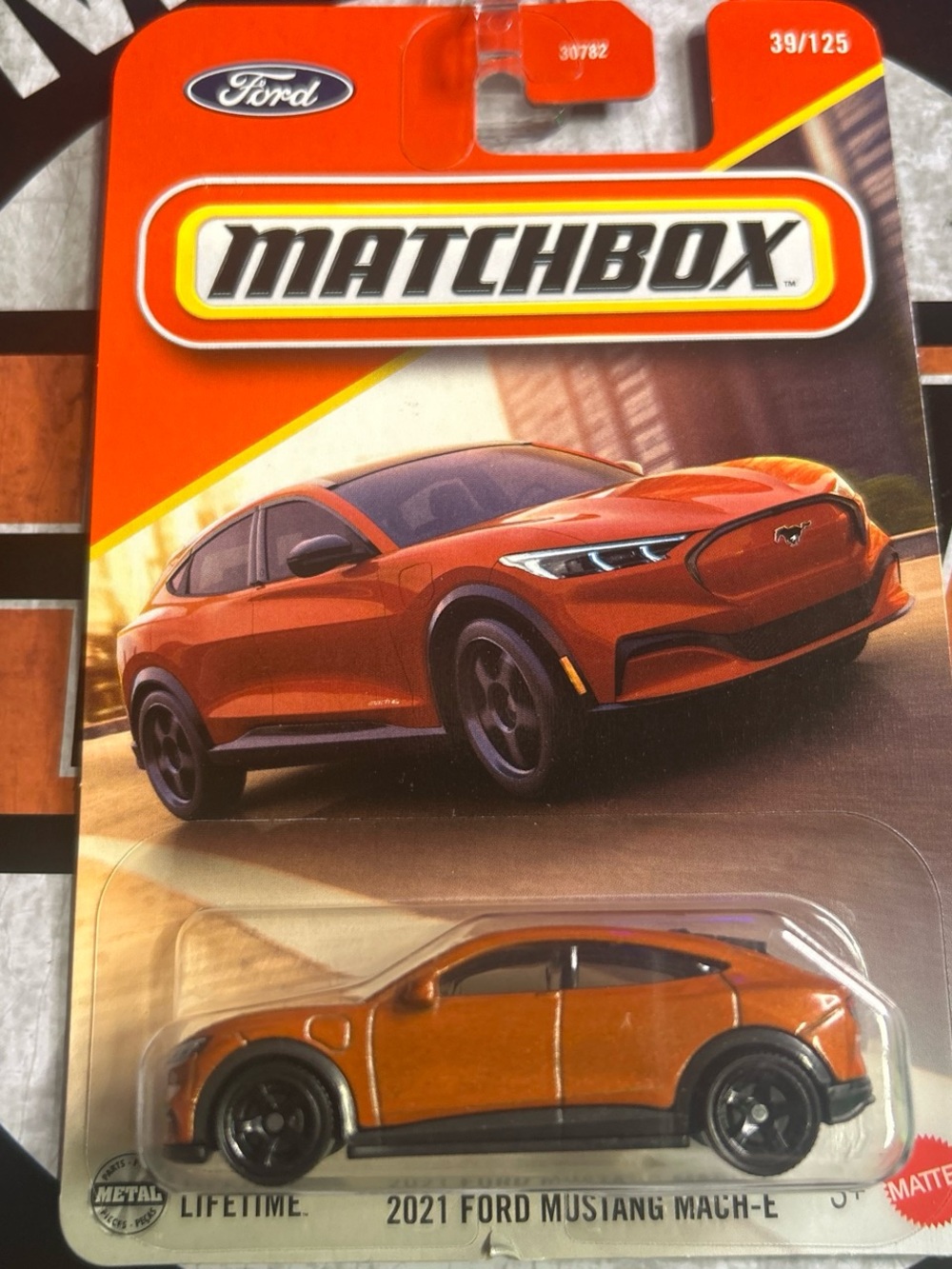 Matchbox 2021 Ford Mustang Mach-E Toy Car - Orange with Black Accents